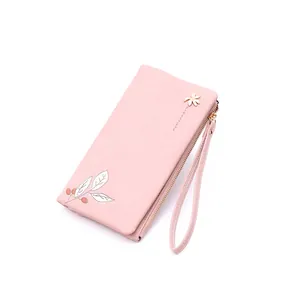 Detailed side view of pink PU leather long wallet with leaf print and gold flower charm