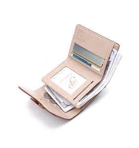 Interior detail of beige women's small wallet with multi card slots and cash pocket