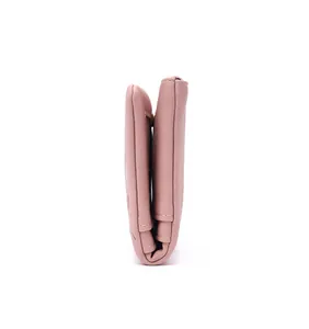 Side view of a dusty rose PU leather wallet showing thickness and folded layers