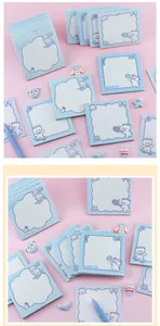 Close-up of cute blue bear non-sticky notepad set on a pink background with cute accessories.
