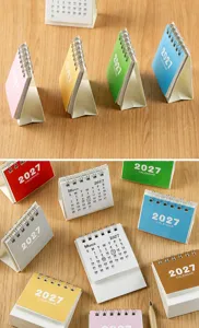 Detail view of colorful 2027 mini desk calendars with stable triangular folding bases.