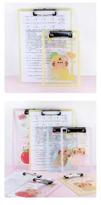 Desktop display of multiple cute cartoon tiger acrylic clipboards with colorful patterns