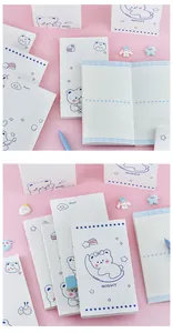 Cute white bear notebook detail with grid pages and starry blue illustrations