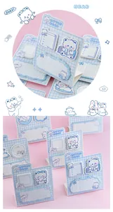 Close-up of cute Little Bear sticky notes with blue grid pattern and bear illustrations