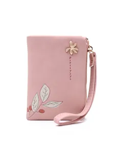 Pink floral print small wallet with gold flower accent and wrist strap