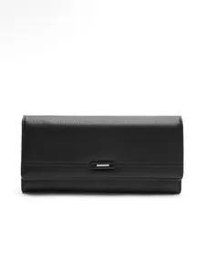 Elegant black pebbled leather long wallet for women with minimalist clasp detail.
