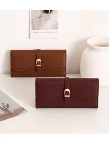 Elegant long women's wallet in brown and burgundy leather with gold buckle detail