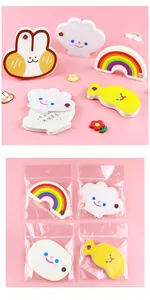 Detail view of various cute cartoon shaped sticky notes with individual clear packaging