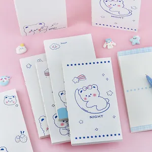Cute white bear illustration journals with blue line art on a soft pink background.