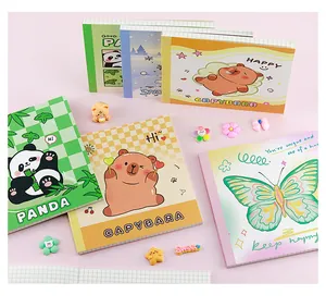Collection of cute cartoon notebooks with panda and capybara motifs and grid inner pages