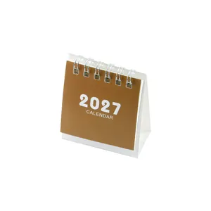 Minimalist 2027 desk calendar with a brown cover and white coil binding for desktop