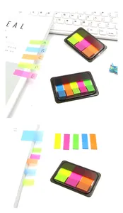 Close-up of colorful fluorescent index tabs in a pull-out dispenser box for organizing
