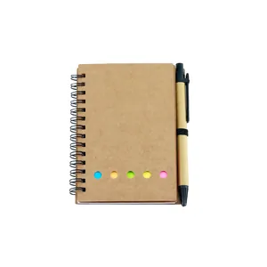 Eco-friendly kraft paper spiral notebook with matching pen and colorful sticky note tabs.