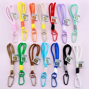 Collection of colorful nylon braided lanyards with carabiners for backpack keychains