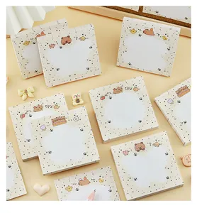 Detail of cute capybara and bear memo pads with speckled cream background and heart props.