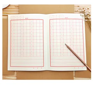 Close-up detail of red Mi Zi Ge grids in a thickened hard calligraphy practice notebook