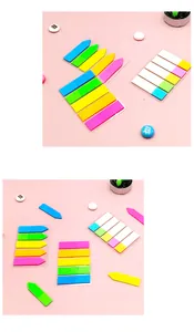 Close-up of colorful fluorescent sticky index tabs for organizing and page marking.