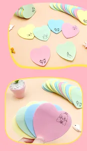 Close-up of Morandi heart sticky notes with cute hand-drawn cartoon designs.