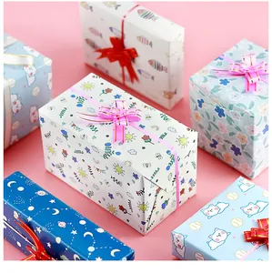 Close-up of colorful cartoon gift wrapping paper featuring cute animal and flower patterns
