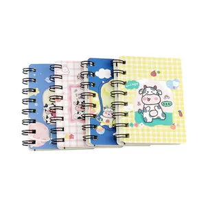 Set of four cute cartoon cow spiral mini notebooks portable pocket sized for notes and journaling