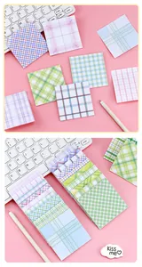 Colorful plaid and checkered pattern sticky notes stationery set on pink backdrop