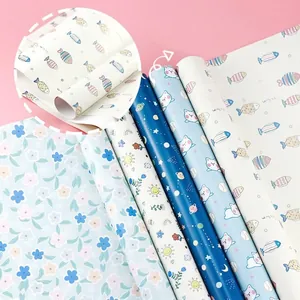 Assorted cartoon gift wrapping paper rolls featuring five cute patterns for DIY