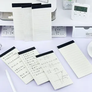 Minimalist long portable memo pads with TODO list and grid patterns on white desk