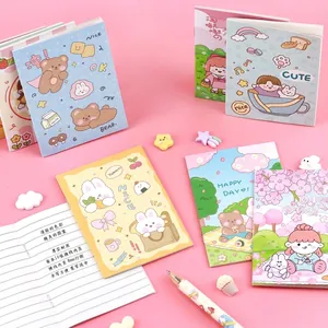 Set of various cute cartoon mini notebooks featuring bear and rabbit designs on pink background