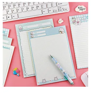 Detail of cute rabbit cartoon memo pads with grid and lined paper for students