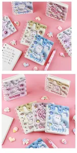 Detailed view of cute 3D bunny spiral notebooks with colorful dessert-themed puffy covers.