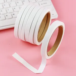 Strong high-viscosity white double-sided adhesive tape rolls for manual DIY school stationery.