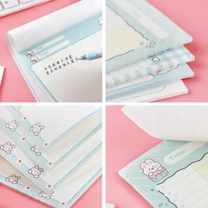 Set of cute cartoon bunny notepads featuring grid and ruled pages for student stationery