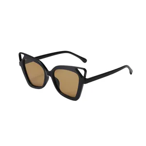 Trendy oversized hollow cat-ear sunglasses with black frame and brown lenses for women.