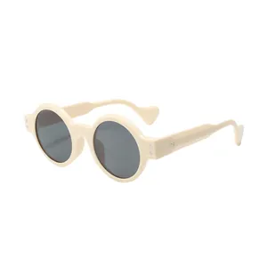 Lunettes de soleil rondes style steampunk avec monture crème épaisse et verres foncés
