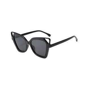 Stylish oversized cat-eye sunglasses featuring hollow out corners and premium black lenses