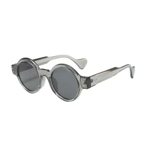 Lunettes de soleil rondes steampunk à monture épaisse grise translucide
