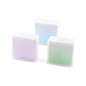 Three-pack of pastel non-adhesive memo notes in clear square plastic storage boxes