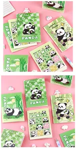 Macro detail showing a variety of cute cartoon panda mini pocket notebooks for students