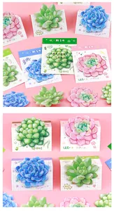Close-up of vibrant succulent-shaped sticky notes in pink, green, and blue colors