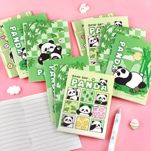 Set of cute cartoon panda mini notebooks with green covers on a vibrant pink background