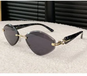 Detailed close-up of rimless diamond-cut sunglasses featuring elegant marble pattern temples.