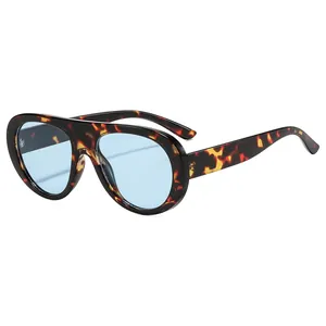 Classic aviator sunglasses with tortoiseshell frame and light blue lenses for trendy look.
