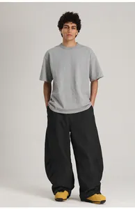 Pantalones de snowboard negros holgados para hombre y mujer, pernera ancha e impermeables