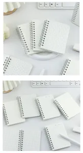 Detail view of mini spiral notebooks with grid and lined pages and frosted PP cover