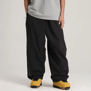 Pantalones de esquí cargo negros cortavientos e impermeables con dobladillo ajustable