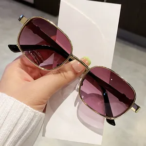 Vintage square sunglasses featuring gold metal frames and purple gradient fashion lenses