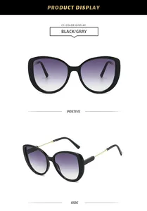 Detailed display of oversized cat-eye sunglasses featuring purple gradient lenses and gold arms.