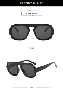 Detail view of retro aviator sunglasses with thick black frame and dark lenses.