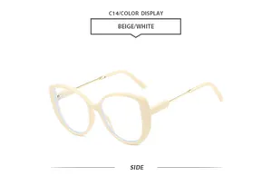 Side view of fashionable oversized beige frame sunglasses with slim gold metal temples