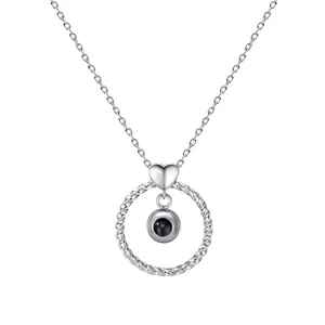 Elegant silver-toned heart and twisted circle projection necklace with a photo stone pendant